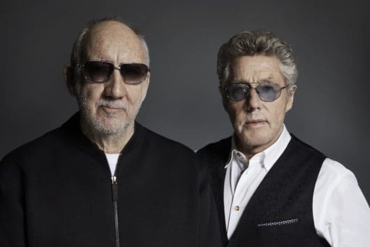 Pete Townshend and Roger Daltrey of The Who stand side by side facing forward