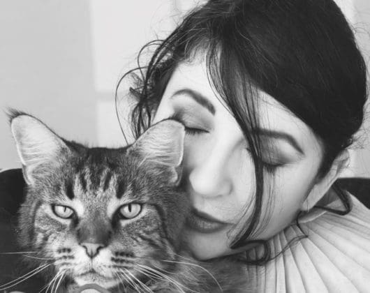 Black and white picture of Kate Bush with Cat