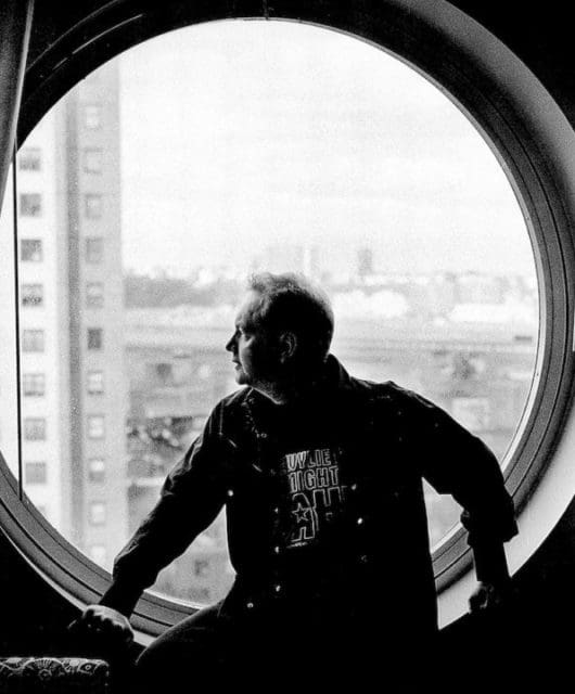 b/w image of Pete Wylie looking out of a window