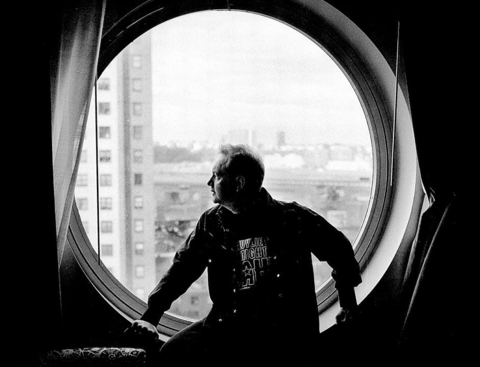b/w image of Pete Wylie looking out of a window